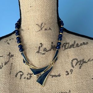 Vintage acrylic blue beaded statement necklace with blue enamel focal piece 18”